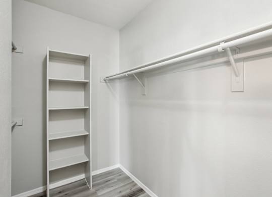 A white closet with a shelf and a white door at Sweetwater At Metro North Apartments, Arizona