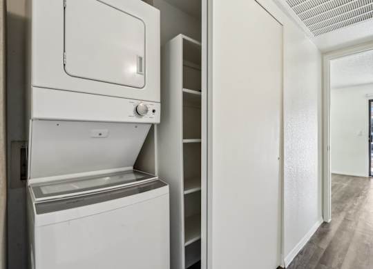 A white dishwasher and oven in a kitchen.