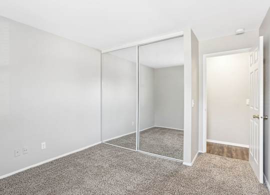 A room with white walls and a carpeted floor. at Millennium at Creve Coeur, Missouri