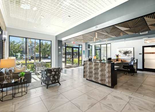A reception area with a desk and chairs.