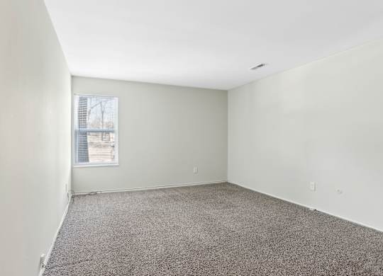Empty room with carpeted floor and a window. at Millennium at Creve Coeur, Creve Coeur