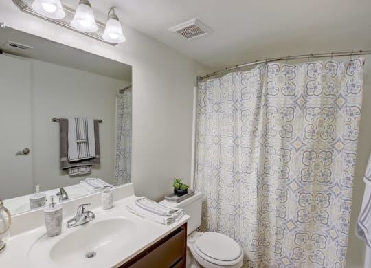 Bathroom with Vanity, Toilet & Shower with a curtain at Glen at Mesa Apartments, Mesa