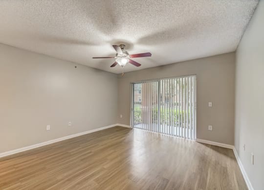 Living room with woodstyle floors and ceiling fan at Pembroke Pines Landings, Pembroke Pines, FL, 33025