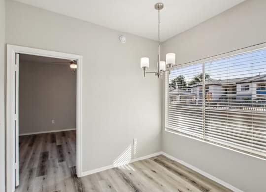 A room with a white door and a chandelier at Sweetwater At Metro North Apartments, Phoenix, Arizona