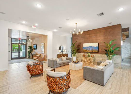 a living room with couches and chairs at Edge75, Naples, Florida 34104