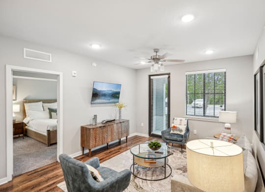 a living room with a couch and chairs and a table at Edge75, Naples, Florida 34104