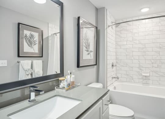 a white bathroom with a shower and a sink at Edge75, Naples, Florida 34104