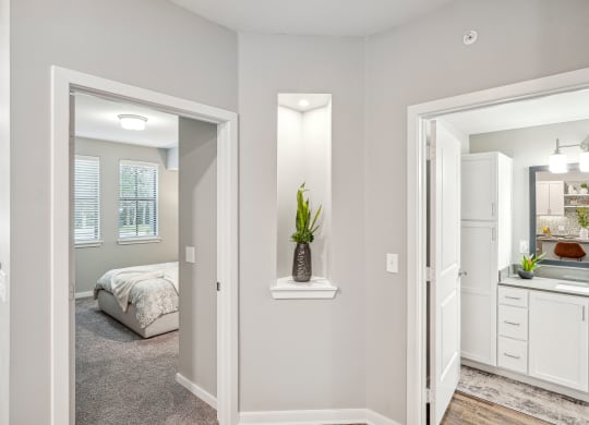 a bedroom and a bathroom with a bed and a mirror at Edge75, Naples, Florida 34104