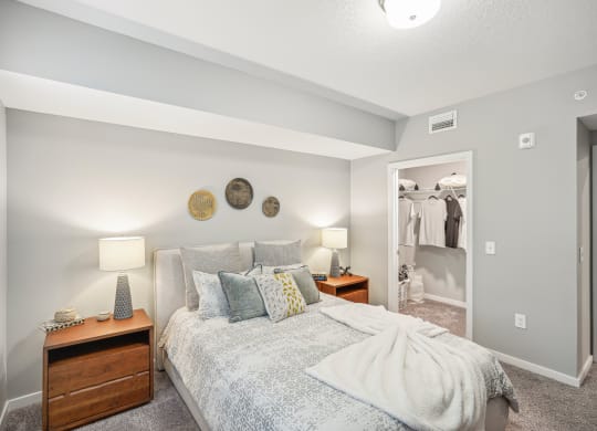 a bedroom with a bed and a closet at Edge75, Naples, Florida 34104