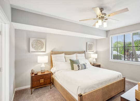 a bedroom with a large bed and a ceiling fan at Edge75, Naples, Florida 34104
