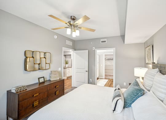 a bedroom with a large bed and a ceiling fan at Edge75, Naples, Florida 34104