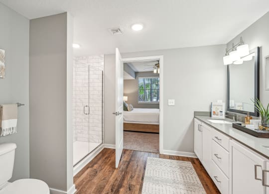 a bathroom with a shower and a sink and a mirror at Edge75, Naples, Florida 34104