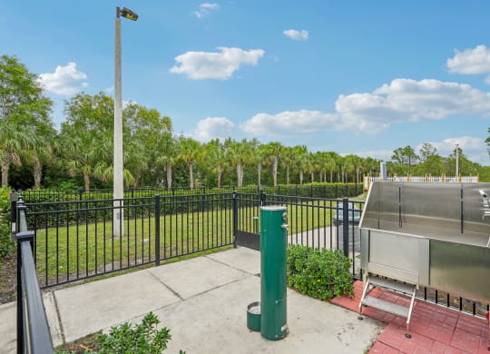 a fenced in area with a hot pool and a fence at Edge75, Naples, Florida 34104