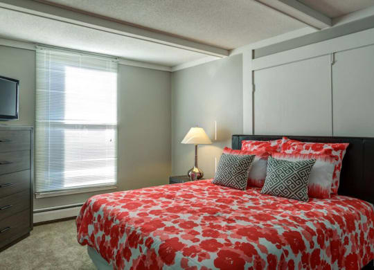 bed with orange at Glen at Burnsville, Burnsville Minnesota