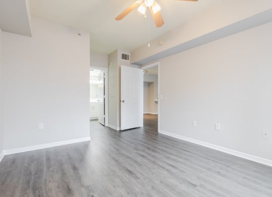 a bedroom with hardwood floors and white walls at Heritage Bay, Florida, 34957