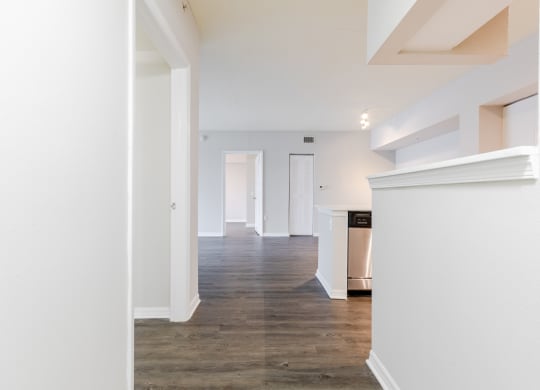 a living room with white walls and a wooden floor at Heritage Bay, Jensen Beach, 34957