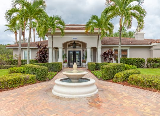a house with a fountain in front of it at Heritage Bay, Florida