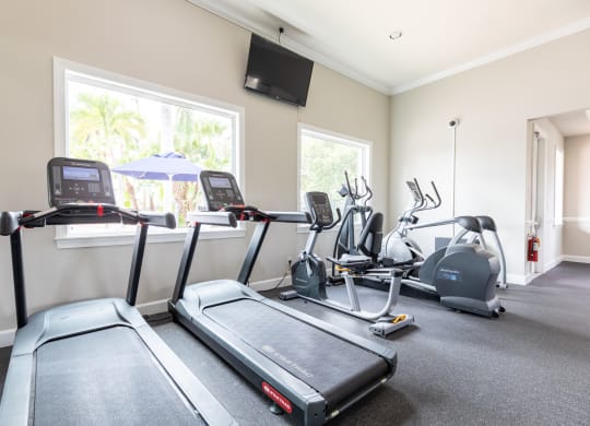 two treadmills and two ellipticals in the exercise room at Heritage Bay, Florida, 34957