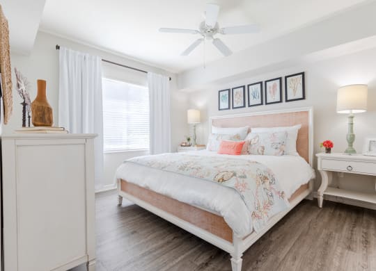 a bedroom with a bed and two nightstands at Heritage Bay, Florida