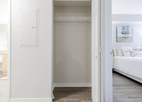 a bedroom with a bed and a closet at Heritage Bay, Jensen Beach, FL 34957