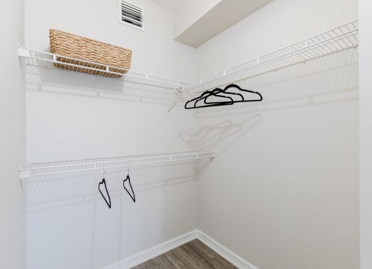 a spacious walk in closet with white walls and a ceiling with a vent at Heritage Bay, Florida