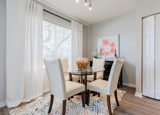 a dining room with a table and chairs at Heritage Bay, Jensen Beach Florida