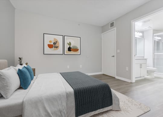 Bedroom with a large bed and a bathroom