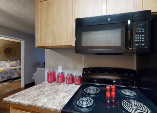 Kitchen with black appliances at Glen at Hidden Valley, Nevada