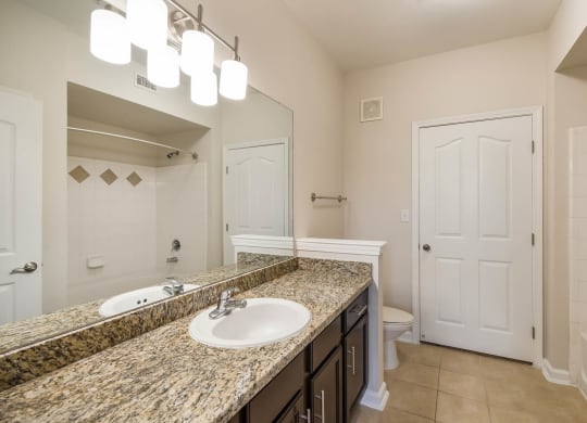 Bathroom With vanity Lights at Kingwood Glen, Texas, 77339
