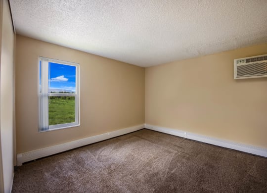an empty room with a window and an air conditioner at Broadmoor Springs, Colorado Springs, CO, 80906