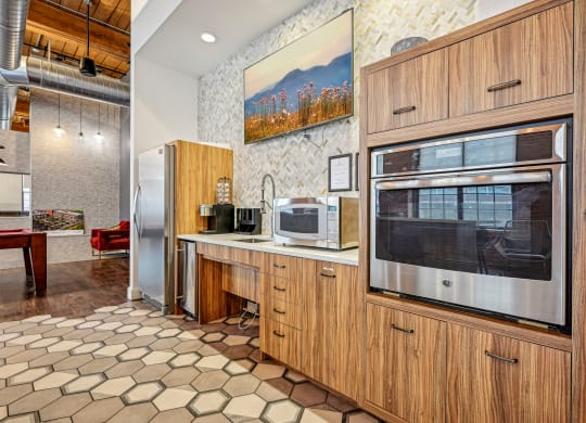 a kitchen with a microwave oven and a refrigerator at Riverwalk Apartments, Lawrence, MA