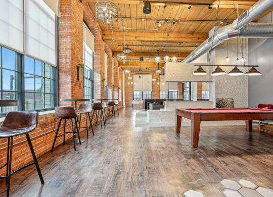 a game room with a pool table and a ping pong at Riverwalk Apartments, Lawrence, MA