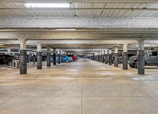 an empty parking garage with cars parked in it at Riverwalk Apartments, Lawrence, MA