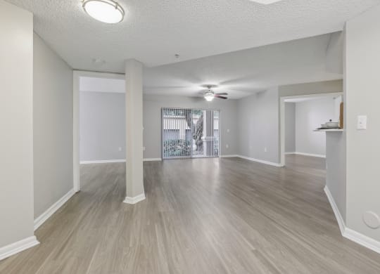 the living room and dining room of an empty apartment at Pembroke Pines Landings, Pembroke Pines, Florida, 33025