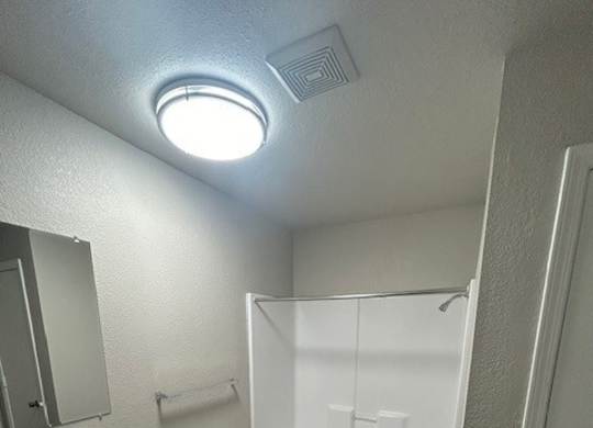 A bathroom with a toilet, sink, and bathtub.at Chapel Ridge of Stillwater, Stillwater, 74075