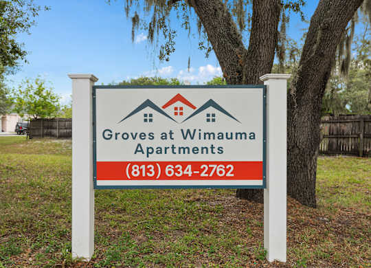 a sign for groves apartments at The Groves at Wimauma Apartments , Wimauma, FL