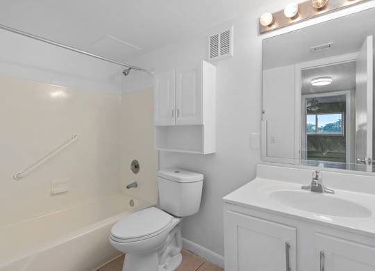 a bathroom with a toilet and a sink and a bath tub at Cypress Grove, Lauderhill, FL, 33313