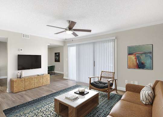 a living room with a couch and a ceiling fan at Lakeside Villas, Orlando, FL 32817