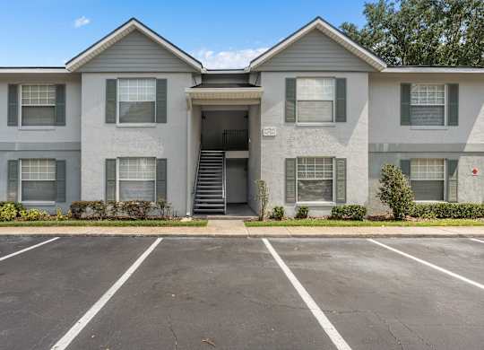 an empty parking lot in front of an apartment building at Oak Reserve at Winter Park, Florida, 32792
