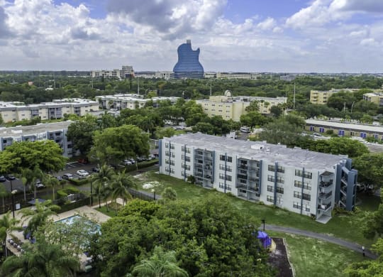 a cityscape with a large blue water tower in the background and apartment buildings in the foreground  at Club at Emerald Waters, Hollywood