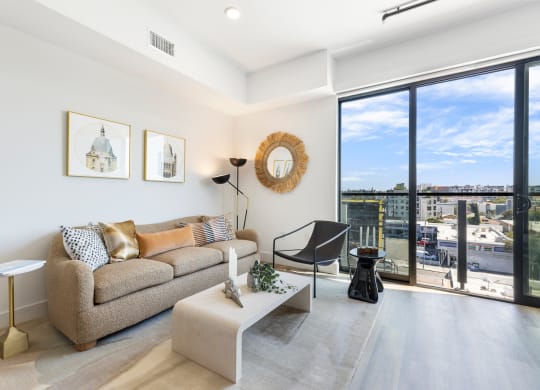 Cozy living room with a teddy couch modern/retro coffee table, and boho decor.