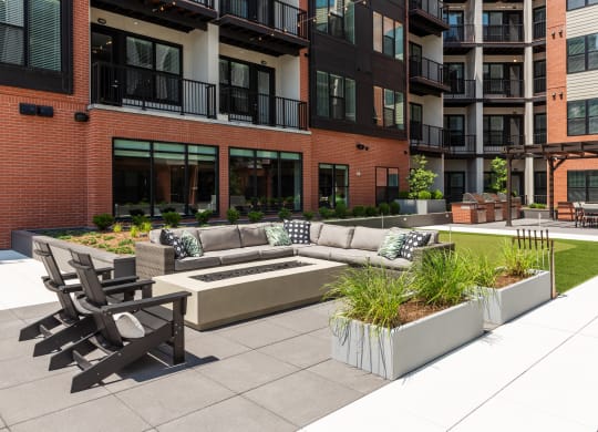 Resident courtyard with fire pit and conversational seating  at Chapter at the Streets of St Charles, Saint Charles, Missouri