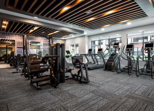 Large modern fitness center with cardio equipment and strength training machines  at Chapter at the Streets of St Charles, Saint Charles, MO, 63303
