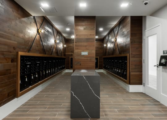 Large resident mail room with entry to parcel package lockers  at Chapter at the Streets of St Charles, Saint Charles