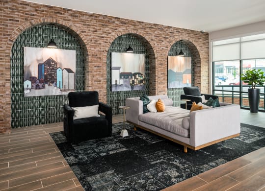 Modern resident lounge with chase lounge and arm chairs  at Chapter at the Streets of St Charles, Saint Charles, 63303