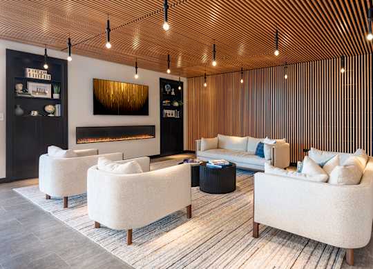 A modern living room with a fireplace and a sofa.