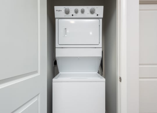 Full-size stackable washer and dryer in unit  at Chapter at the Streets of St Charles, Saint Charles, Missouri