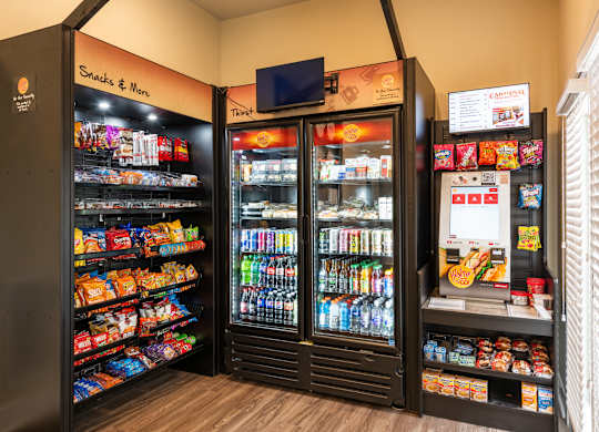 A snack and drink vending machine with a variety of items.