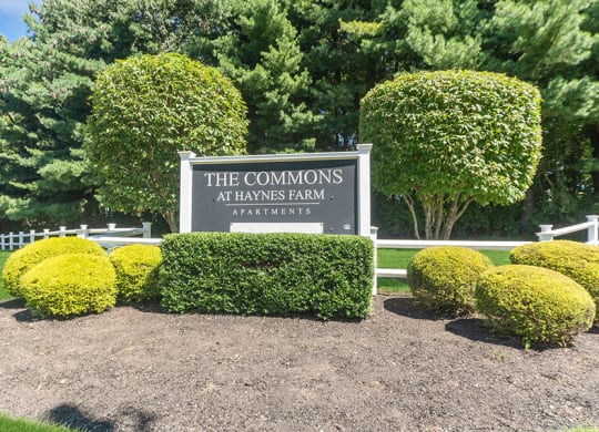 Monument Sign and Front Entrance at The Commons at Haynes Farm Apartments in Boston, MA.