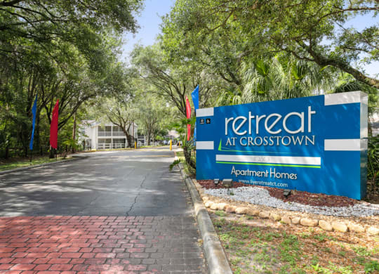 Retreat at Crosstown Apartments sign at entry